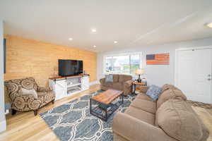 Living room featuring light laminate flooring