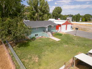 Exterior space with a garage and a front yard