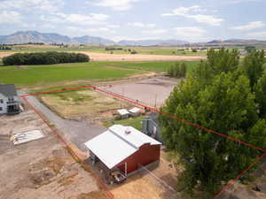 Birds eye view of property featuring a rural view and a mountain view