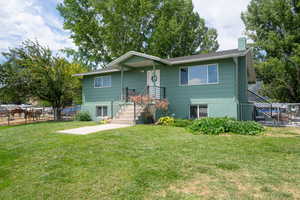 View of front of property with a front lawn