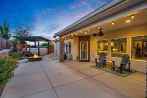 Patio terrace at dusk with a fire pit