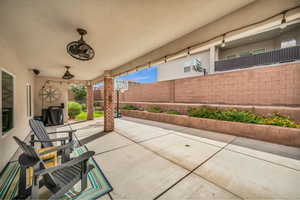 View of patio featuring ceiling fan