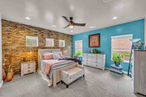 Bedroom featuring light carpet and ceiling fan