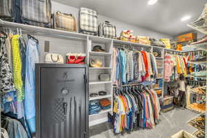 Spacious closet with carpet floors