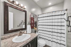 Bathroom with vanity and toilet