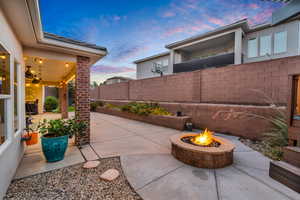 Patio terrace at dusk with a fire pit