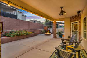 Patio terrace at dusk with a fire pit