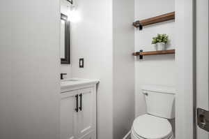 Bathroom with toilet and vanity