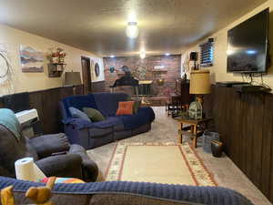 cozy den/ family room downstairs with fireplace