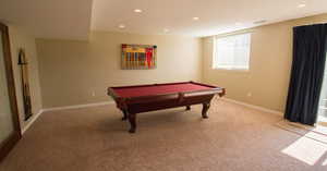 Rec room with light carpet and billiards