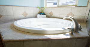 Primary Bathroom with a relaxing tiled tub