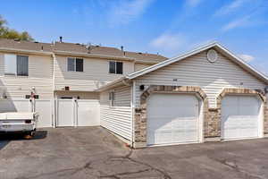 View of front facade featuring a garage