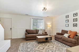 Living room with light colored carpet