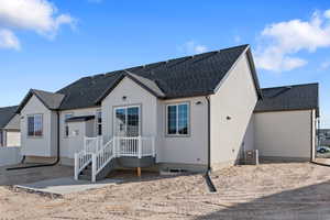 Rear view of property with central AC unit