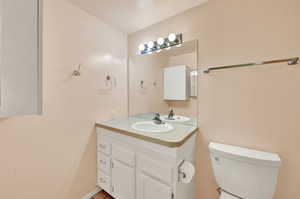 Bathroom featuring toilet and vanity