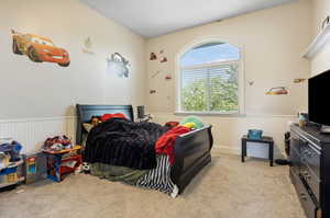 Bedroom with light colored carpet