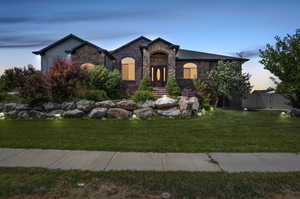 View of front of property featuring a yard