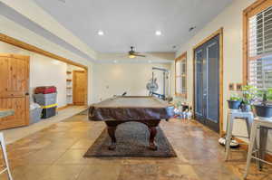 Recreation room featuring ceiling fan, light tile patterned floor