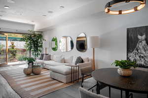 Living room featuring a textured ceiling and hardwood / wood-style flooring