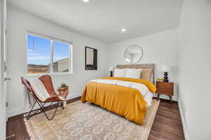 Bedroom with wood-type flooring