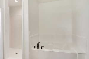 Bathroom with shower with separate bathtub