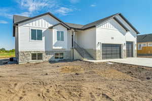 View of front of property with a garage