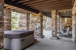 View of patio featuring a hot tub