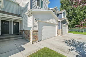 View of side of home with a garage