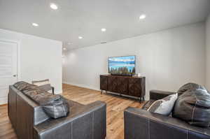 Living room with light wood-type flooring