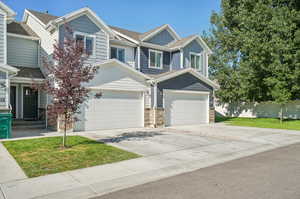 Craftsman-style house featuring a garage