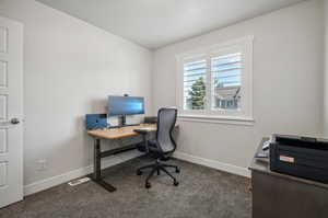 View of carpeted home office