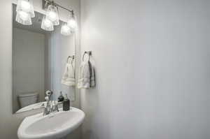 Bathroom featuring sink and toilet