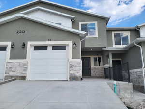 View of front facade featuring a garage