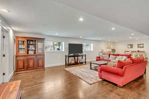 Living room with wood-type flooring