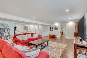 Living room with hardwood / wood-style flooring