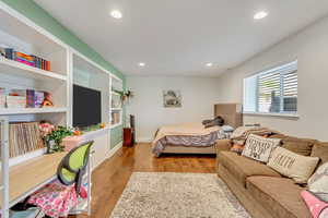 Bedroom featuring wood-type flooring