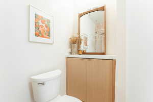 Bathroom with modern vanity and toilet