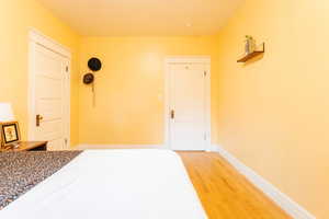 Bedroom with hardwood flooring