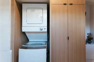 Washroom with stacked washer and dryer