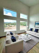 AI loft staging. Living room with hardwood / wood-style flooring