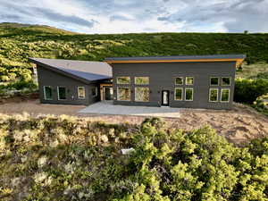 Rear view of property featuring a patio area