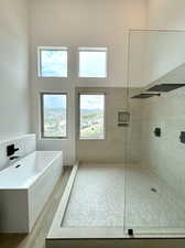 Bathroom featuring shower with separate bathtub and hardwood / wood-style floors