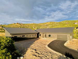 Ranch-style home with a mountain view and a garage