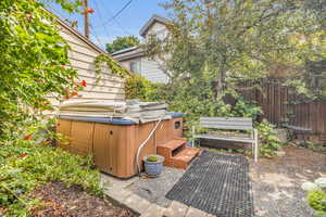 View of patio / terrace with a hot tub