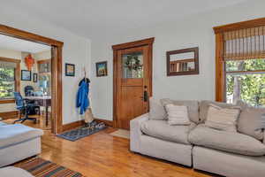 Living room with a wealth of natural light and light hardwood / wood-style floors