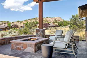 View of patio featuring a fire pit