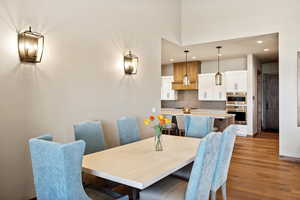 Dining area with hardwood / wood-style flooring