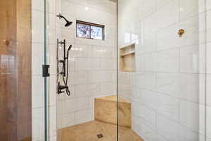 Bathroom with a shower with shower door