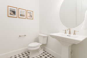 Bathroom featuring tile patterned flooring and toilet