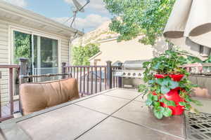 View of patio / terrace with a mountain view and a grill